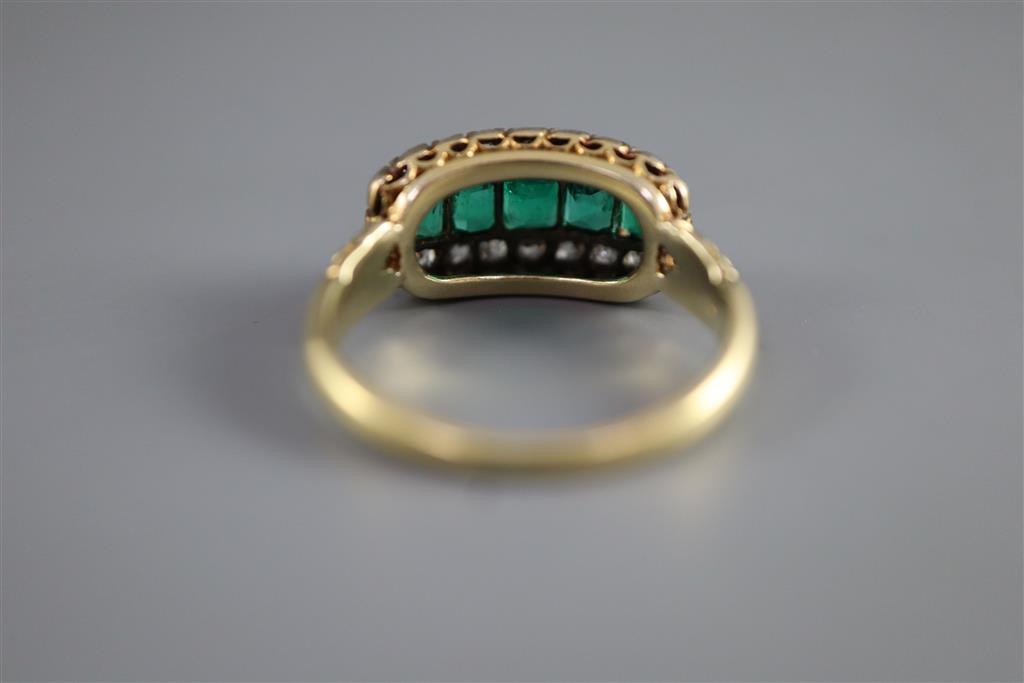 A late Victorian gold, graduated five stone emerald and diamond cluster half hoop ring,